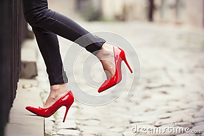 woman wearing red high heel shoes in city Stock Photo