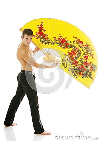 young athletic man with yellow fan Stock Photo