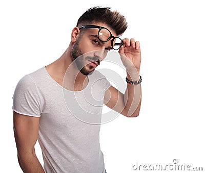 young casual man removes his glasses Stock Photo