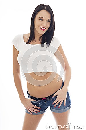 Young Caucasian Woman Wearing a White Vest Top and Blue Den Stock Photo