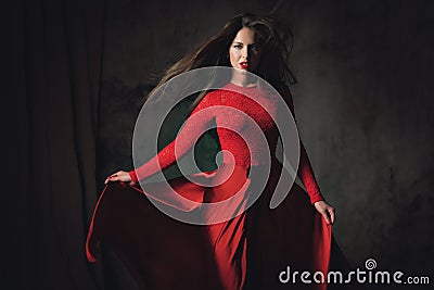young lady in fluttering red dress Stock Photo