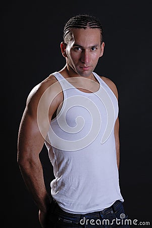 young male in white vest top Stock Photo