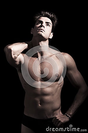 young man shirtless. Gym muscular body. Neck pain. Stock Photo