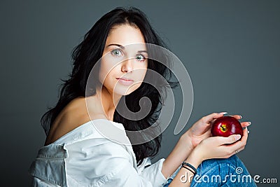 young woman with fresh red apple Stock Photo