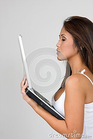 Young Woman Viewing Laptop Stock Photo