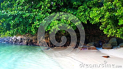 Seychelles Beach White Sand along the road Stock Photo
