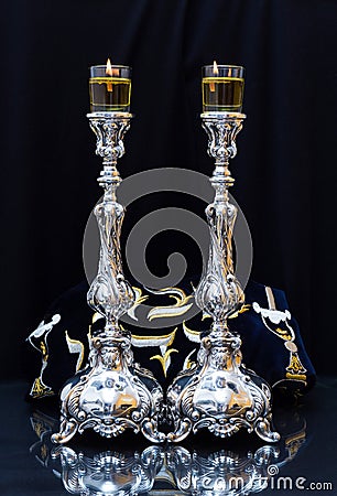 Shabbat candles. Silver candlesticks with olive oil Stock Photo