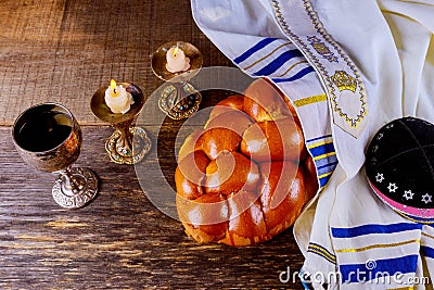 Shabbat challah bread, shabbat wine and candles on the table. Top view Stock Photo