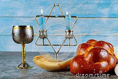 Shabbat challah bread, shabbat wine and candles on the table. Top view Stock Photo