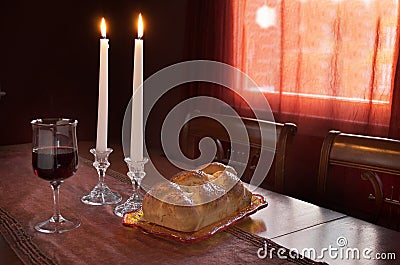 Shabbat Observance At Sunset: Challah, Glass of Wine, Two Lit Candles Stock Photo