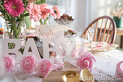 Shabby Chic pink baby shower decorations on table Stock Photo