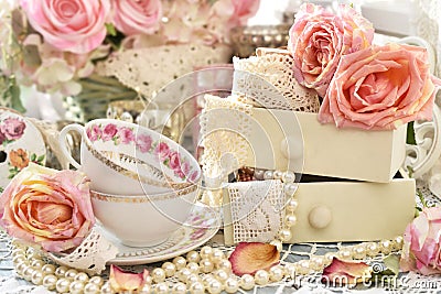 Shabby chic style decorations with tea cups, roses and laces Stock Photo