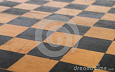 shabby surface of an old wooden chessboard Stock Photo