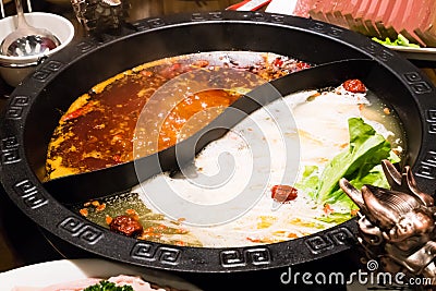 The shabu pot in Chinese style - pork soup and oily spicy soup Stock Photo