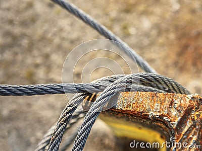 Shackles attached to wire cables and safety net Stock Photo