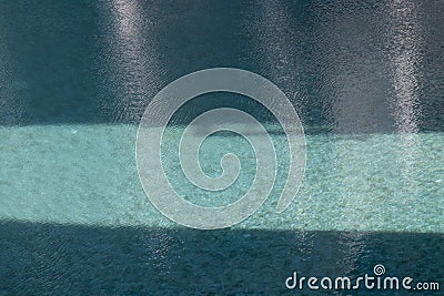 Shade and Shadow on the blue swimming pool Stock Photo