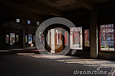 Shaded interior of incomplete building on sunny winter day Stock Photo