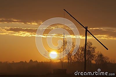 Shadoof just after sunrise Stock Photo