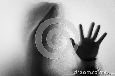Shadow blur of horror man in jacket with hood.One hands on the g Stock Photo