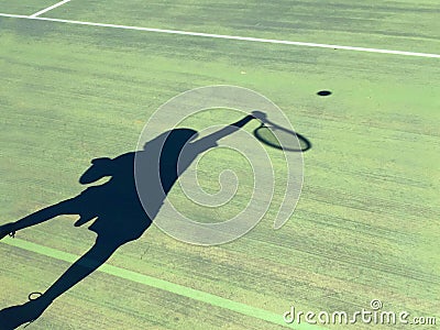 Shadow of a boy playing tennis Stock Photo