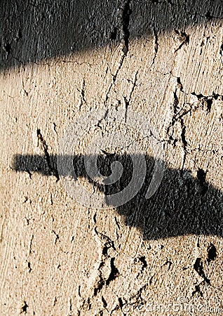 Shadow of the hand pointing a gun Stock Photo