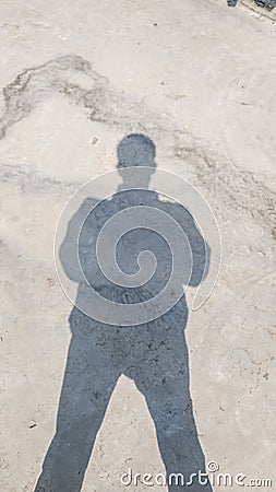 Shadow of a human being in careful posture. Stock Photo