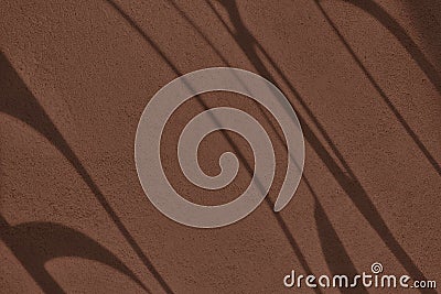Shadow and light on solid brown wall texture background Stock Photo