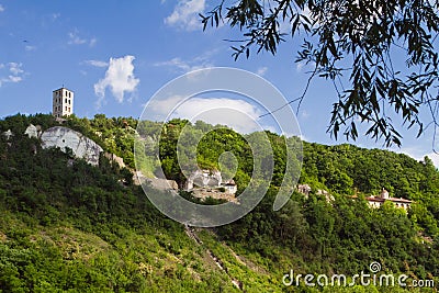 Shadow play on Beheading of John the Baptist Rock Friary with ancient monk caves cut in coquina cliff and modern monastery Editorial Stock Photo