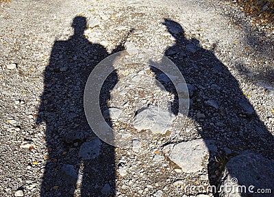 Shadow of two armed men Stock Photo