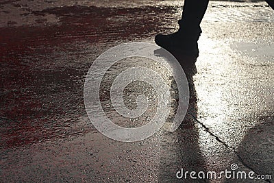 Shadow of unrecognizable person at pedestrian crossing - Back li Stock Photo