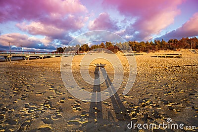 Shadows on the beach at sunset Stock Photo