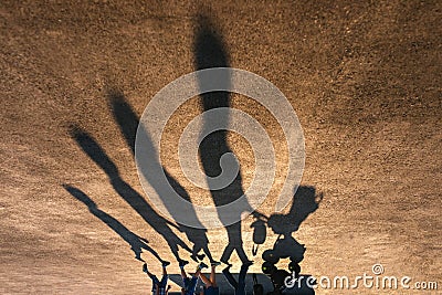 Shadows of family with baby in a pram Stock Photo