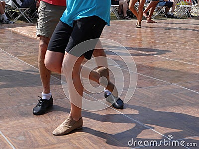 Shadows follow the quickstepping feet Stock Photo