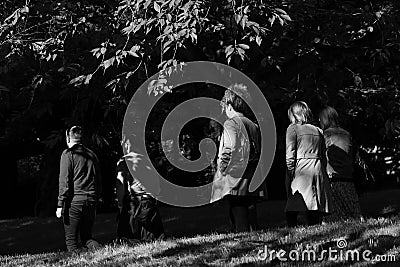 Shadows on a Group of Friends as They Enjoy an Early Morning Walk. Editorial Stock Photo