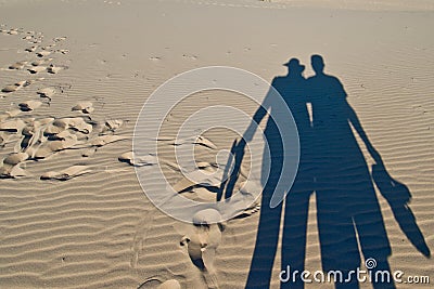 Shadows of pair of tourists Stock Photo