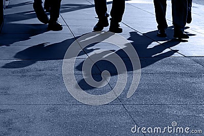 Shadows of People Walking Stock Photo