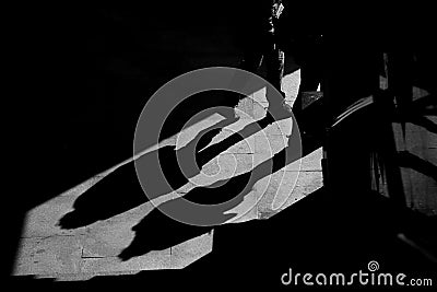 Shadows on the wall from walking people. Abstraction Stock Photo
