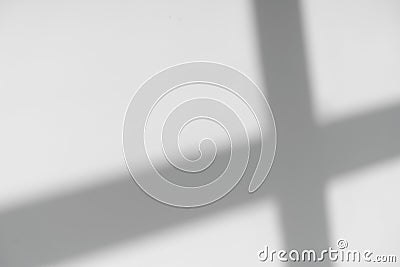 Shadows of window lines on a concrete stone wall in a bright room background. Abstract, geometry, light concept Stock Photo
