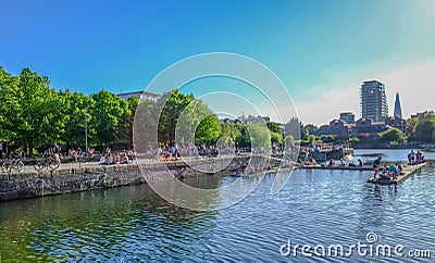 Shadwell Basin on a hot day with lots of people enjoying the sun Editorial Stock Photo