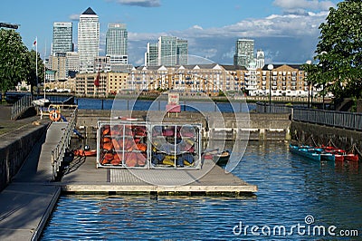 Shadwell Basin water sports and Canary Wharf, UK Editorial Stock Photo