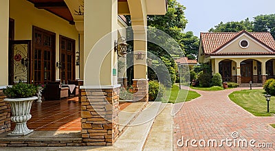 Shady porch of fresh building in sunny summer Stock Photo