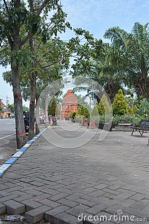 Shady trees in a roadside park. in front of the Mojokerto square. Editorial Stock Photo