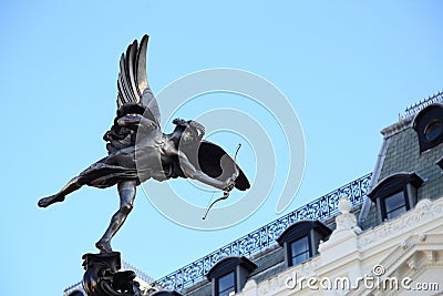 Shaftesbury Memorial Fountain, statue of a mythological figure Anteros Eros `s brother with blue sky background, Piccadilly Editorial Stock Photo