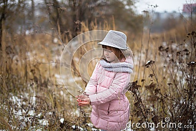 Shaggy girl in jacket, gray scarf and fedora hat Stock Photo