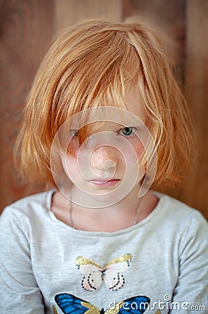 Shaggy girl looks underfoot Stock Photo