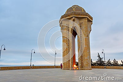 Shahidlar Monument or Eternal flame Monument on Martyrs` Lane in the evening. Baku. Azerbaijan Editorial Stock Photo