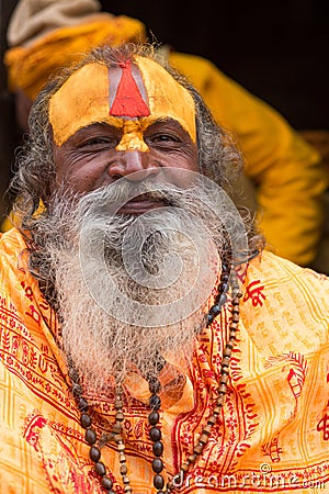 Shaiva sadhu smiling and posing on the street Editorial Stock Photo