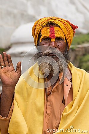 Shaiva sadhu smiling and posing on the street Editorial Stock Photo