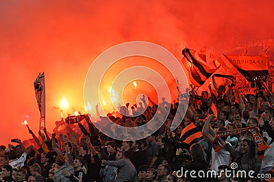Shakhtar fans lit yellow fireworks in the stands Editorial Stock Photo