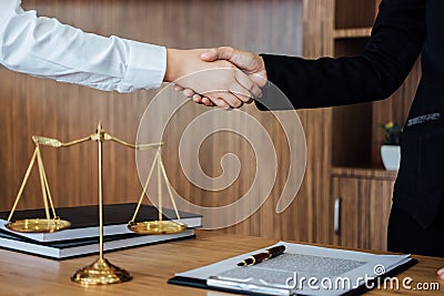 Shaking hands after good cooperation, Business woman handshake female lawyer after discussing good deal of contract, Meeting and Stock Photo